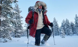 The man from the second image is in a snowy landscape, wearing a red winter parka and holding trekking poles.