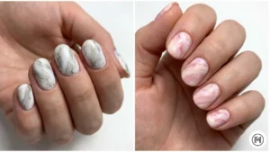 11. Marble Nails Alt Text: Luxurious marble nail designs on short nails featuring classic white and gray swirls alongside spring-inspired pastel pink blends.