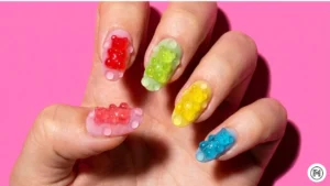 12. 3D Gummy Nails Alt Text: Playful 3D gummy nails with raised candy-like shapes in bright summer colors.