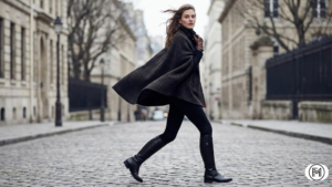 Luxury winter resort style with a beige shearling jacket and structured cream trousers.