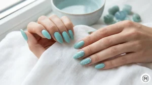 15. Aquamarine Calm: "Serene aquamarine blue nails with tiny clear crystal accents mimicking ocean water."