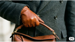 High-end minimalist black puffer jacket paired with straight-leg tailored denim jeans.