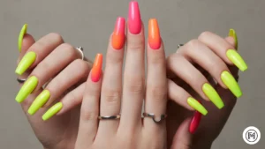 Alt Text: Vibrant neon gradient acrylic nails transitioning from yellow to green and pink to orange.