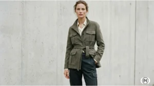 2. Luxe Utility Dressing feMale model in premium luxe utility wear featuring tailored wool cargo pants and a technical cashmere belted jacket.