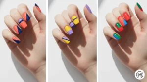 Alt Text: Clean color block acrylic nail design with bold coral and navy blue sections.