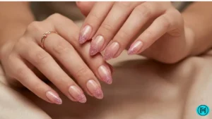 French tip nails featuring tiny Valentine symbols like hearts and arrows.