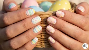25. Easter Egg Design: "Festive Easter egg inspired nails with speckled patterns, stripes, and polka dots in pastel hues."