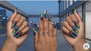 Alt Text: Bold neon geometric acrylic nail designs with sharp lines and bright pink and green colors.