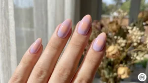 3. Aura & Gradient Nails Alt Text: Dreamy aura gradient nails featuring blurred transitions of lavender and peach colors. 