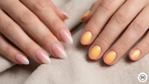 5. Aura Gradient: "Dreamy aura gradient nail art in soft sunrise pink and pastel yellow tones for 2026 spring fashion."