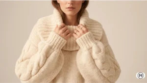 5. Statement Knitwear Close-up of a chunky statement knit sweater with intricate stitching and an oversized, dramatic collar. 