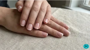 Ombre French tip manicure with a seamless blend from pink to white.