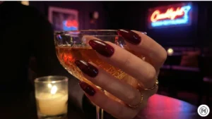 6. Dark Jelly Textures Alt Text: Sophisticated dark jelly nails in translucent burgundy and navy blue for evening wear. 