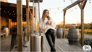 Edgy winter winery fashion with black leather trousers and a white chunky knit sweater.