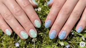 9. 3D Dewdrop Nails: "Hyper-realistic 3D dewdrop nail art with clear resin water droplets on a sage green base."