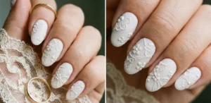 A split image showing bridal nails. The matte white oval nails feature raised, 3D embossed texture mimicking floral lace patterns. The hand holds lace fabric and a gold wedding ring.