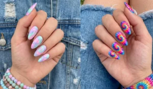 A horizontal collage of two tie-dye almond nail designs on denim. The left shows a pastel watercolor swirl, and the right shows a vibrant retro tie-dye pattern.