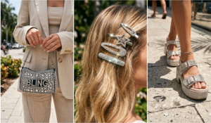 A highly detailed 3-panel collage in a triptych layout, focusing on Y2K McBling rhinestone accessories, styled tastefully for 2026. The scene is bright and sun-drenched. Left Panel: A close-up of a glamorous, rhinestone-studded handbag, held by a woman's manicured hand (wearing simple gold rings). The bag is a mini purse heavily adorned with various sizes of shimmering crystals and features the text "BLING" made of crystals. She wears a neutral beige linen blazer and top. The background is a paved street with trees and blurred pedestrians. Center Panel: A tight close-up of multiple crystal-embellished hair clips, nestled in a woman's healthy, sun-kissed wavy blonde summer hair. The clips include barrettes, a star-shaped clip, and a "Y2K" text clip, all sparkling brilliantly in the sunlight. The background is a softly blurred garden setting with greenery. Right Panel: A detailed close-up of a pair of high-platform, rhinestone-studded sandals, worn by a woman walking on textured pavement in the sun. The bulky 2000s-style sandals are completely covered in glittering crystals, reflecting the bright light. She wears a delicate anklet. Pavement textures and palm leaf shadows are visible.