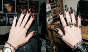 Two images detailing dark Y2K E-girl grunge junk nails with a moody matte black and cherry base, draped in miniature silver chains, heavy gothic crosses, and safety pins.