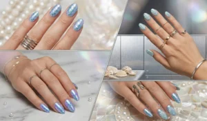 Mermaid-core inspired nails featuring iridescent, color-shifting scales and raised 3D seashell texture in ethereal ocean blue and lavender tones.