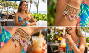 Stack of crystal charm bracelets featuring rhinestone palm trees and hibiscus flowers.