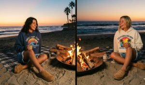 A 2-panel image of friends at a beach bonfire at sunset, wearing oversized vintage surf-brand hoodies with retro graphics, distressed low-waist denim shorts, and chunky suede mules.