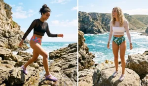 A side-by-side photo of two women exploring rocky coves wearing sheer mesh long-sleeve crop tops with retro high-waisted bikini bottoms and chunky transparent jelly sandals.