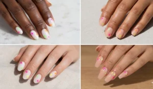 Minimalist milky white and sheer nude nails decorated with tiny, hand-drawn neon starburst accents.
