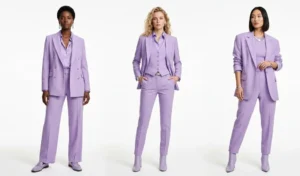Three women styling bold lavender pastel monochromatic outfits, showcasing sharp, masculine-inspired tailored suits with minimalist metallic accessories.